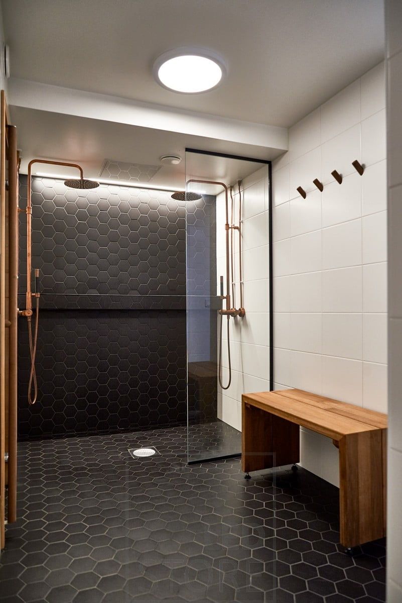 In the washroom, an LED ceiling as general lighting and behind the showers, a special tile accentuated by an indirectly illuminated LED strip. Ledstore.fi